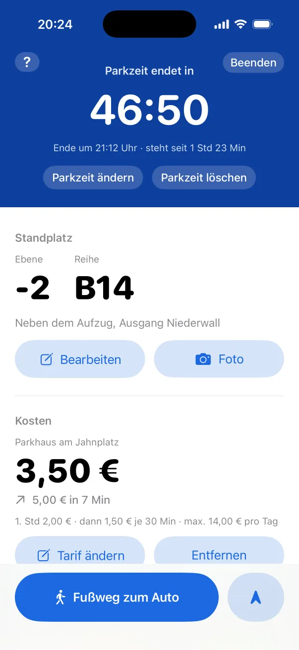 Active parking session: “Parkzeit endet in 46:50” (parking ends in 46:50), level −2, row B14, note “Neben dem Aufzug” (next to the lift), €3.50 so far and the button “Fußweg zum Auto” (walk to car).